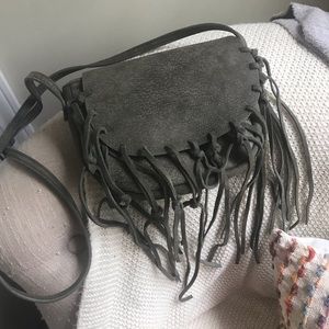Street level muted green/grey fringe purse.